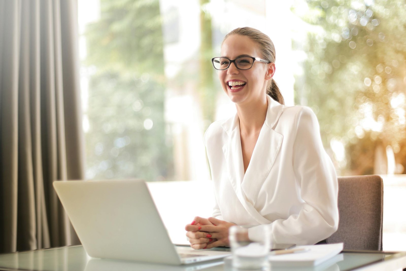 A smiling Clinical Study Startup Specialist presenting a checklist for site activation.